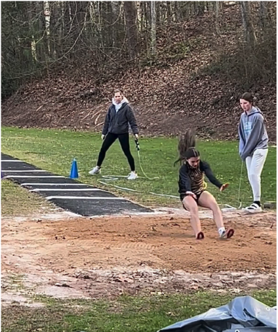 Photo by Hali McClure Micalynn McClure competes in her first triple jump.