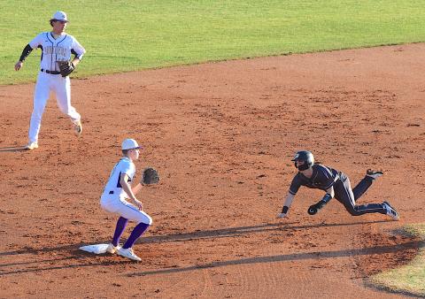 Gary Corsair • Clay County Progress Hayesville speed merchant Michael Mauney steals second base at Union County.