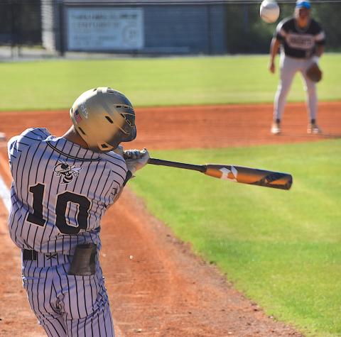 Gary Corsair• Clay County Progress Hayesville third baseman Chance Hughes connects against Robbinsville in the Yellow Jackets 11-1 triumph on Monday. 