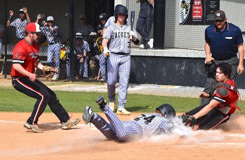 Gary Corsair • Clay County Progress Peyton McGaha slides home ahead of the tag to give Hayesville a run against Andrews on Thursday.