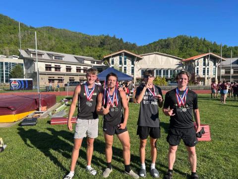 The 4x200 track team members are, from left, Isaac Chandler, Seth Leek, Elio Murillo and Kenyon Rogers-Gibby.