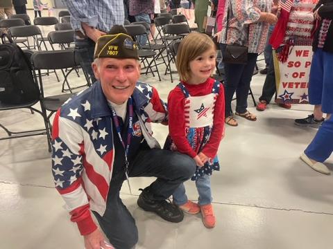 Photo by Maureen Moss Dwight Moss greeted a young patriot during an Honor Flight celebration in Asheville on Saturday April 27.