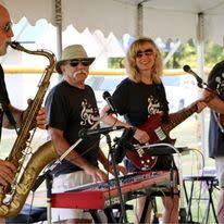 Sweet Charity’s Rockin’ Replay coming to the Hiawassee Square with David Bacon on lead guitar and Karen Bacon on bass guitar.