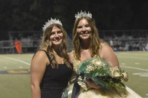 2024 Homecoming Queen Mallory Peck, on right, smiles after being crowned by last year’s queen, Gracelynn Anderson during Friday’s half-time festivities at the football game in Hayesville. Brooke Graves was named runner-up. 