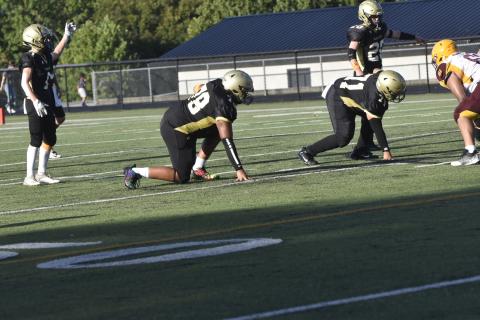 Leeanna Alberta • Clay County Progress No.78, E.J. Mapasua and No. 71, Jonathan Godomez prepare for take-down.