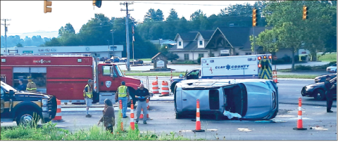 Becky Long • Clay County Progress Rescue workers secure the scene of a two-car traffic accident at the heavily travelled bypass intersection in Hayesville.