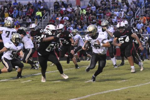 Leeanna Alberta • Clay County Progress  Hayesville’s Tate Roberts, No. 5, pushes the ball down the field in Friday’s game in Andrews. 