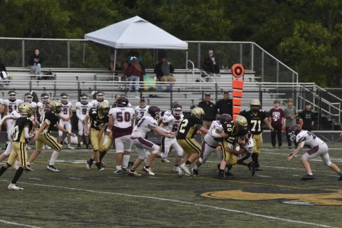 Leeanna Alberta • Clay County Progress Caden McClure No. 20, is taken down while, No.72, Tucker Moore and, No. 71, Jonathan Godinez help fight the defense. 