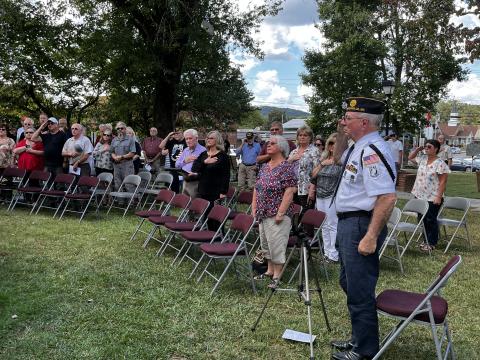 Crowd pays respect at POW/MIA recognition as the Remembrance Flag was placed at its rightful position.