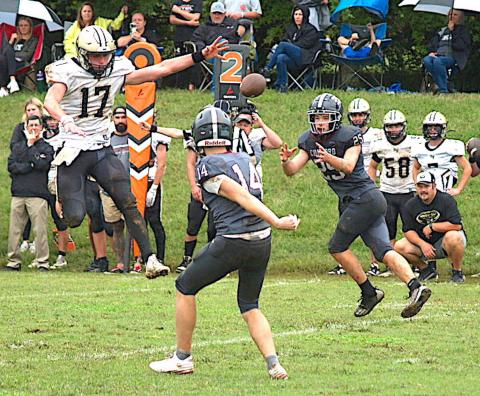Gary Corsair • Clay County Progress Hayesville's Johan Webb, No. 17, goes airborne in an attempt to thwart a Concord Christian pitchout.