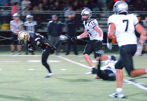 Gary Corsair • Clay County Progress Michael Mauney, No. 24, struggles to keep his footing after leaving Robbinsville defenders in his dust on a big gain for the Yellow Jackets.