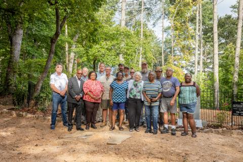 Many people were involved in the preservation work at Freedom Cemetery. According to Pastor Harold Holbrook of Fort Hembree Baptist Church, the recent work has been made possible by the partnership of the Clay County commissioners and a lot of volunteers. Front, from left, Commissioner Scott Penland, Harold Holbrook, Theresa Holbrook, Annie Lloyd, Betty Bradley, Betty Dorsey, Kent Dorsey and Lisa Dorsey; center, Commissioner Clay Logan, Larry Dennison and Lewy Dennison of Dennison Brothers Landscaping; Jole