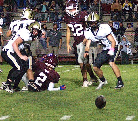 Gary Corsair• Clay County Progress Hayesville's Eli Jack, No. 7, and Silas Lovingood, No. 34, are thinking "fumble recovery" after teammate Matt Gorham, No. 54, dropped a Maroon Devil ball carrier.