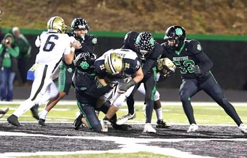 Photo by Keith McCurry Hayesville's Dawson Devane, No. 32, bullies his way through the Mountain Heritage defense as Tre Graves, No. 6, supplies a block.