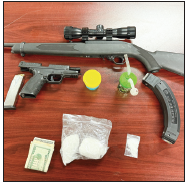 Officers reported firearms and meth in the suspect’s vehicle  and on his person.