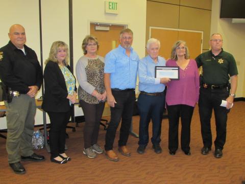 Lorraine Bennett • Clay County Progress From left, Todd Wingate, Renee Penland, Tarena Davenport, Robert, Leon Sr., Irene Penland and Sheriff Mark Buchanan during recognition at the commissioners meeting last week. 