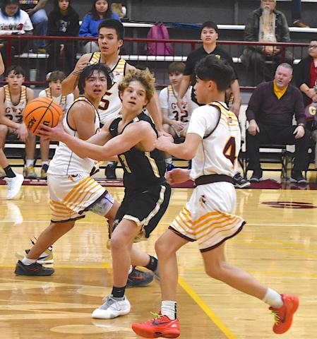Gary Corsair • Clay County Progress Hayesville's Kyle Shaheen, No. 3, dishes to a teammate after dissecting the Cherokee defense.