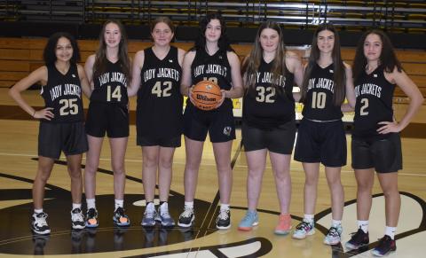 Gary Corsair • Clay County Progress The Hayesville JV girls basketball team, from left, Kadence Morrow, Olivia Free, Breanna Patterson, Micalynn McClure, Danielle Anderson, Kara Bauer and Aaliyah Jackson stands 1-0 and look to make noise in the Smoky Mountain Conference this year. 