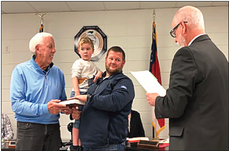Marcia Barnes • Clay County Progress Clay County Schools Board of Education newest member Josh Ashe was sworn in during the December meeting. In the photo, from left are, Josh’s dad, Ed Ashe, son Hudson Ashe with his father Josh and Clerk of Court Tim Barrett. Josh’s father Ed is a former school board member.