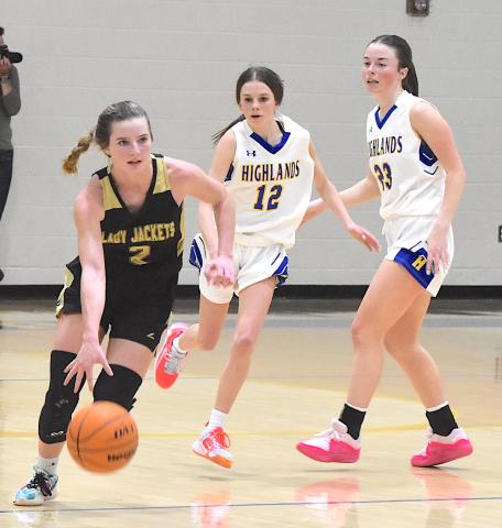 Gary Corsair • Clay County Progress.  Ava Shook leaves Highland defenders in the dust as she triggers Hayesville's offensive attack. 