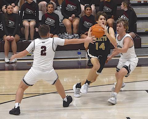 Gary Corsair • Clay County Progress Brady Reynolds, No. 14, slices through Swain County's zone defense as Hayesville rolls to a road win in Smoky Mountain Conference play.