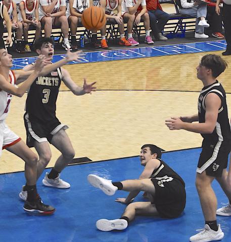 Gary Corsair • Clay County Progress Slade Crouch, No. 3, battles for the basketball as Riley Rogers, No. 11, and Landon Trout, No. 15, watch during a holiday tournament battle. Crouch continues to be a formidable force at both ends of the floor for Hayesville.