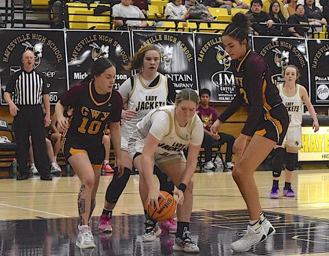 Gary Corsair • Clay County Progress Brooke Graves, No. 40, scrambles for the ball as Mallory Peck, No. 35, and Breanna Abrams, No. 4, watch.