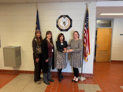From left, Karen Dudley, Hannah Miller, Mary Jo Dyer, State Farm Marketing Director and Superintendent Melissa Godfrey signify the inclusion of Clay County Schools in the Go the Extra Mile Shoe Fund on Tuesday, Feb. 4.