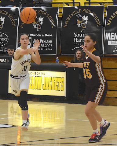Gary Corsair • Clay County Progress Hayesville sparkplug Micallyn McClure, No. 10, zips a pass to the corner for the final shot of the game during a 32-29 overtime loss to Cherokee. Unfortunately, the Lady Jackets didn't get the tying basket.