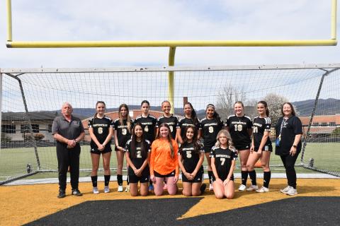 Norashae Patterson • Clay County Progress The Hayesville High School Soccer team players are, front, from left, Noelia Fonceca, Emily Dowling, Alondra Garcia and Emma Elver, back, Head Coach Mike White, Reese Seagars, Leah Thomas, Aydah Judd, Emily Lyvers, Emily Aguilera Garcia, Camila Nava Gamez, Olivia Grizzle, Summer Borchardt and Assistant Coach Kelly Davis.