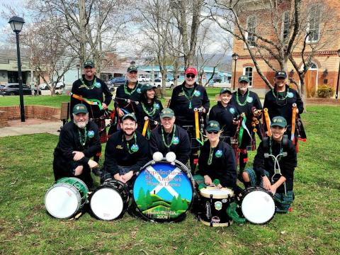Sandy Zimmermann • Photo The Appalachian St. Andrew’s Pipes & Drums musicians are, front from left, Mike Campbell, side drum; Brian Gatti, drum sargeant; Jeff Mackin, bass drum; Jennifer Lombardo, tenor drum, and Mason Campbell, side drum; back from left, Bill Lombardo, pipe sergeant; Jerry Cannon, piper; Emma Campbell, piper; Ron McInnis, pipe major; Richard Smith, piper and Leslie Jones, piper performed classics with a mix of American tunes during the Irish Bash Sunday, March 16 on Church Street.  