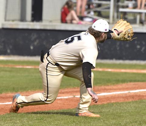 Gary Corsair • Clay County Progress Hayesville third baseman Dawson Devane shows his catlike reflects as he reaches for a foul ball Monday against Cherokee. 