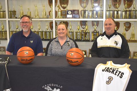 Gary Corsair • Clay County Progress Hayesville High School Principal Stacey Overlin, left, and Athletic Director Mike Cottrell present Tammy Jones Dills as the new varsity girls basketball coach.