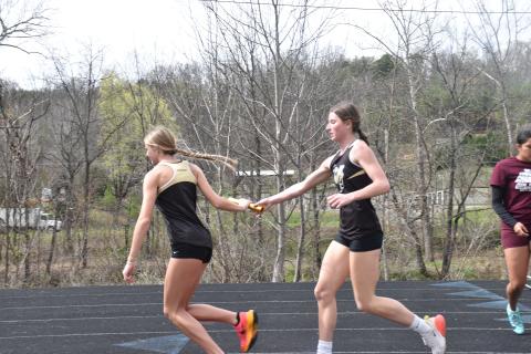 Norashae Patterson • Clay County Progress Lady Jacket relay athletes Ava Shook hands off with Raelynn Wood.