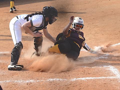 Gary Corsair • Clay County Progress Hayesville catcher Kara Bauer slaps the tag on Amila Lossie as she tries – unsuccessfully – to score