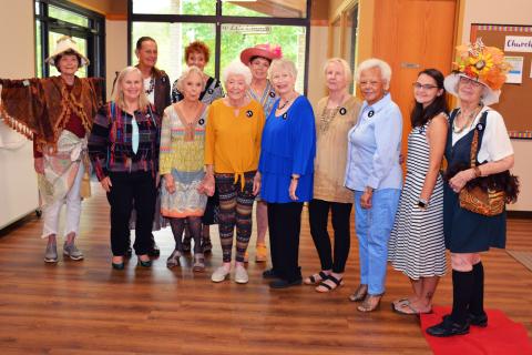 Photo from Facebook page At the Granny's Attic Thrift Store quarterly luncheon volunteers, front, from left, Sandy Jersey, Judy Jeagar, Eva Robinson, Ida Holmes, Katie Dawes, Sandy Lymperis, Lee Brown, Sharon Smith and Ruth Jones; back, Becky Van Gorder, Linda Kennedy and Ruth Coffey wore outfits purchased at the store and did a fashion show. Coffey won.