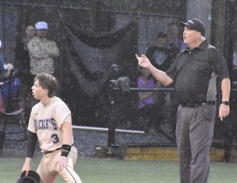 Hayesville's Kyle Shaheen can't believe the call as the umpire declares him out on a stolen base try. The call ended Hayesville’s best opportunity to go ahead against Cherryville. 