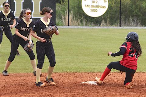 Gary Corsair • Clay County Progress A trio of Lady Jackets descend on second base as an Andrews batter arrives. That's Raylyn Taylor, No. 11, Lily Chastian, No. 8, and Micalynn McClure, No. 10, making sure the Wildcat stops at two