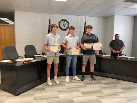 Marcia Barnes • Clay County Progress From left, Brady Reynolds, Slade Crouch and Jackson Sellers were recognized for Men’s 2024/2025 Basketball All Smoky Mountain Conference at the Clay County School Board of Education meeting. Back board member Josh Ashe congratulates the students.