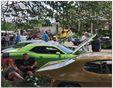 Becky Long • Clay County Progress Autos fi lled three sides of the square on Saturday for the Car-B-Que sponsored by Rotary Club of Lake Chatuge. Next year the event will be held again the fi rst Saturday in June.