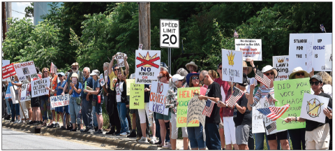 Becky Long • Clay County Progress No Kings protesters line both sides of Old Jailhouse Hill in Hayesville Saturday. The number of local people protesting President Donald Trump’s policies have continually increased over the past few months from the tens to the hundreds.