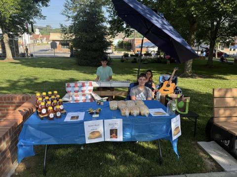 Samuel, Seylah and Seth Brown have been busy selling homemade bread and local honey while also entertaining shoppers with music during the event. They will soon have locally raised Brown’s Beef for sale at the market.