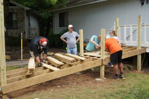 Photo submitted by Hinton Rural Life Center staff A summer mission team works on an accessibility ramp as part of Hinton’s Safe & Healthy Home Repair ministry.