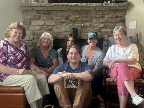 Lorrie Ross • Clay County Progress Some of the friends and neighbors from Bent Grass get together at the home of Karen and Talon Ballard to reminisce about her and the closeness of the neighborhood. In front, Talon holds a cherished picture of himself and his grandmother, Karen, who died in May. From left, friend, Nancy Rowland, who does not live in Bent Grass, but would like to. Next door neighbor, Debbie Wilson, who said her hair is white because of Karen. Neighbor Lilly Sprinkles and Rebecca Sprinkles, w