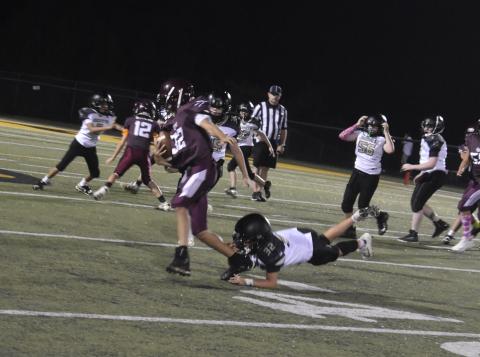 Callie Long • Clay County Progress Levi Cody jumps at the chance to take Swain player No. 32 down.