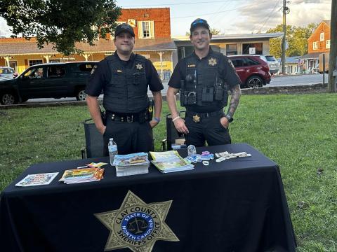 Lorrie Ross • Clay County Progress Clay County School Resource Officers, from left, Shane Mull smiles with his cohort, Kyle Lickteig while handing out information for students and families.