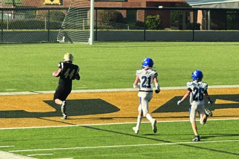 JV Yellow Jacket Grayson Marr out-runs his opponent for a touchdown during Friday’s game.
