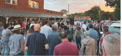 Photo by Tyler Faggard    Dwight Moss gives the opening prayer during a vigil for conservative activist Charlie Kirk.
