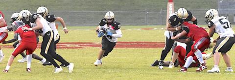 Gary Corsair • Clay County Progress Talk about creating a hole. Hayesville linemen Will Brown, No. 56, Matt Gorham, No. 55, Wyatt James, No. 74, Jonathan Godinz, No. 71 and Brendon Collins, No. 51, punish Copper Basin's trenchmen as Tre Graves, No. 6, explodes through the opening.