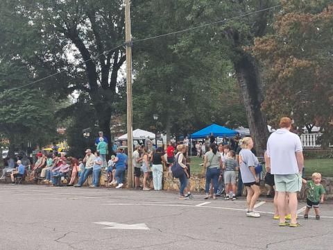 Spectators line the streets of Hayesville waiting for the 12 p.m. tractor parade to begin. The rain held off until the parade was over and many visited the tractors parked on the square.